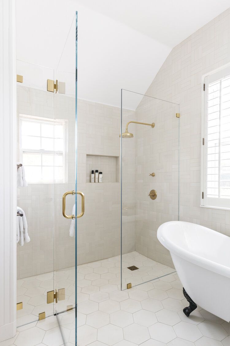 A glass shower cubicle helps in creating a separate bathing 