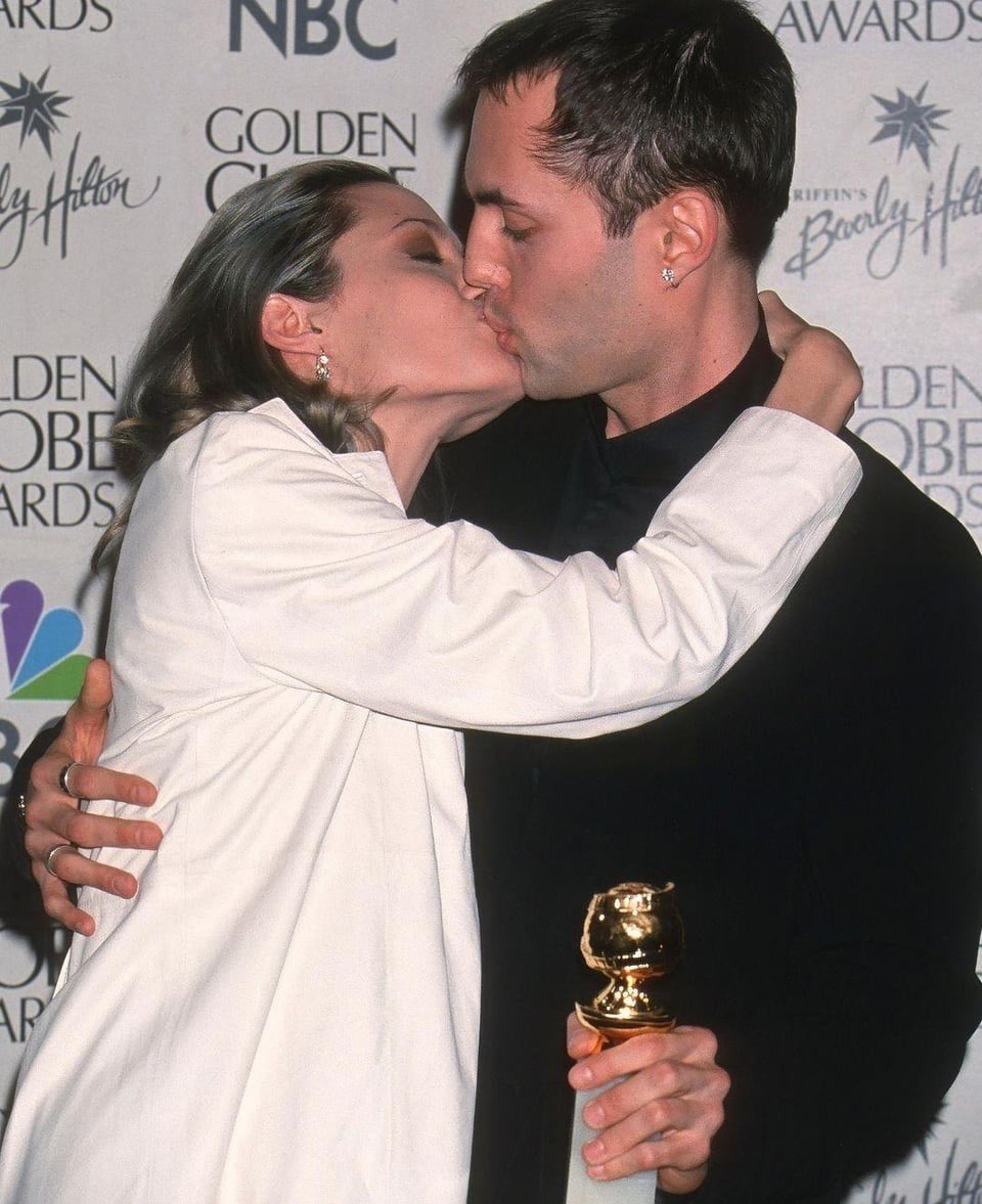 Angelina Jolie kissing her brother