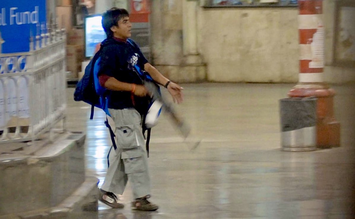 Kasab, ordered by his handler to wear the Kalava, the sacred